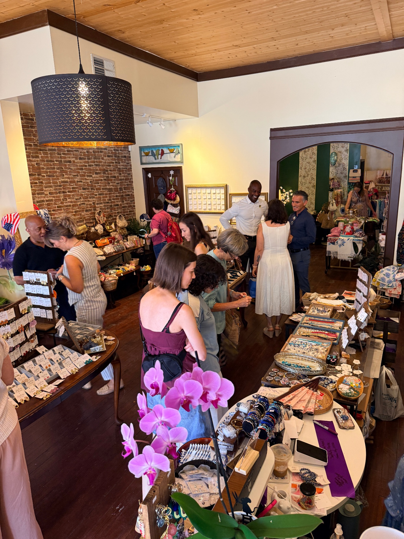 Shoppers exploring curated jewelry and gifts at the grand opening
